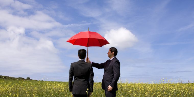 business man holding umbrella Santa Monica CA