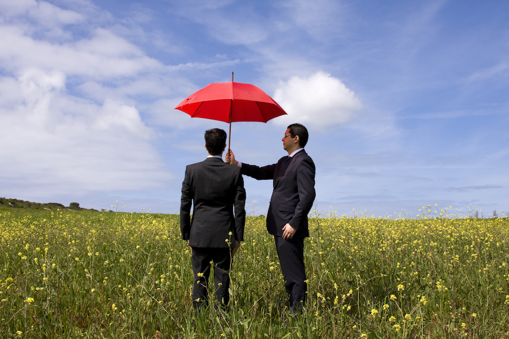 business man holding umbrella Santa Monica CA